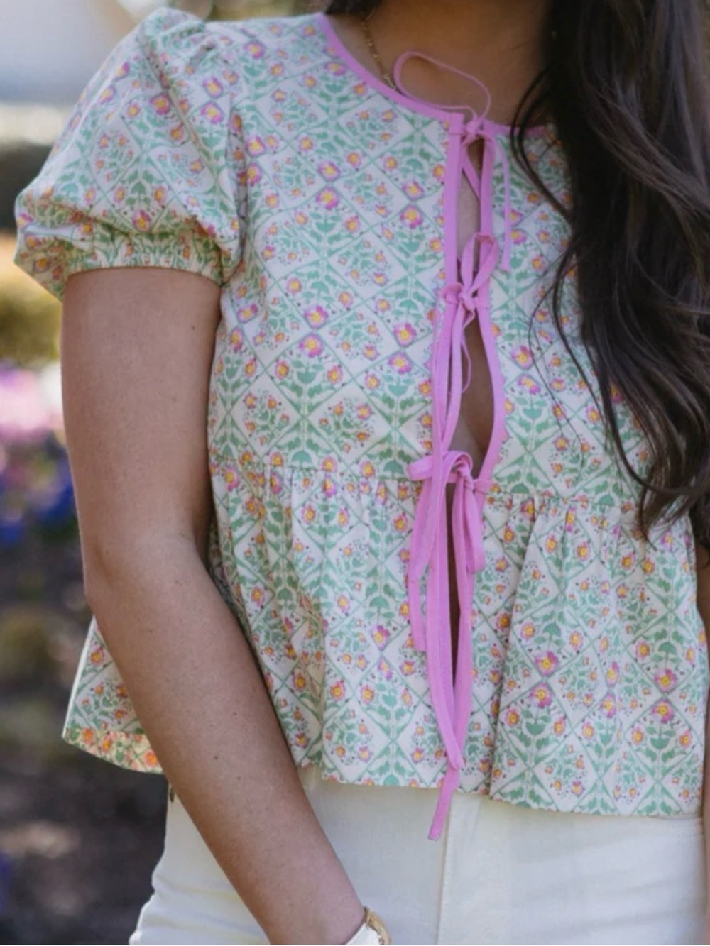 New with tags! Adorable pink and green floral peplum top.